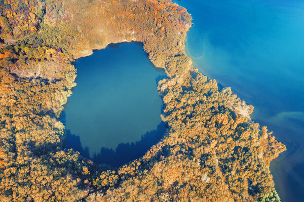 Beautiful mountain lake in autumn. Aerial view of the lake near the sea