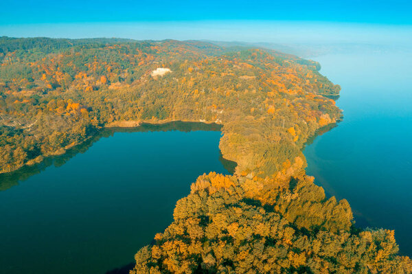 Picturesque mountain lake in autumn. Lake near the sea. Beautiful wild nature. Aerial view