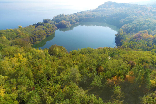 Picturesque mountain lake in autumn. Lake near the sea. Beautiful wild nature. Aerial view;