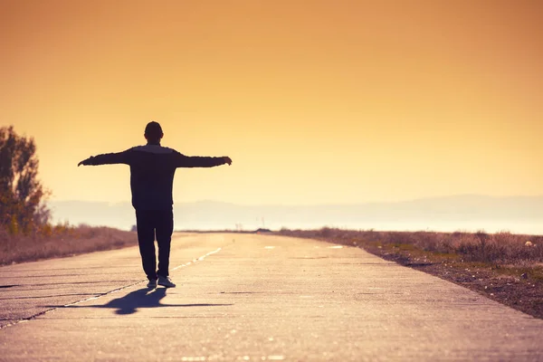 Man Walks Concrete Road Sea Golden Sunset — Stock Photo, Image