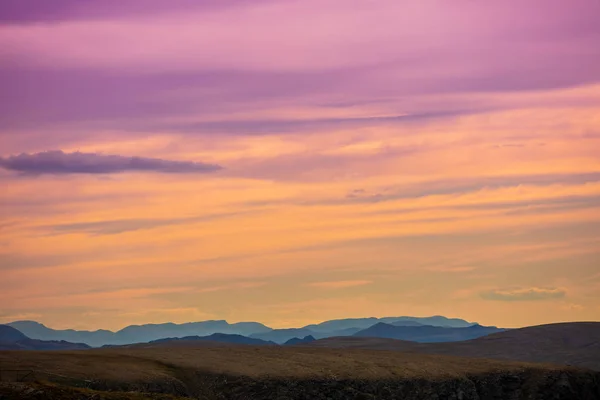 Mountain range in the early morning. Sunrise in mountains. Morning landscape with beautiful gradient sky