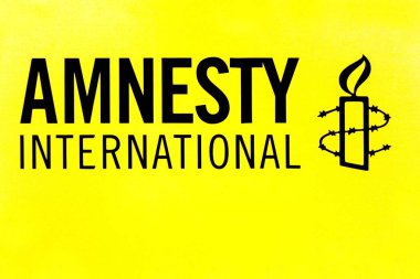 Copenhagen, Denmark - June 24, 2018: Amnesty International logo on a wall. Amnesty International is a London-based non-governmental organization focused on human rights clipart