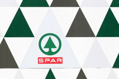 Sete, France - July 3, 2018: Spar logo on a wall. Spar is an international group of independently owned and operated retailers and wholesalers who work together in partnership under the Spar brand clipart