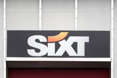 Billund, Denmark - February 20, 2019: Sixt logo on a wall. Sixt is a European multinational car rental company with about 4,000 locations in over 105 countries