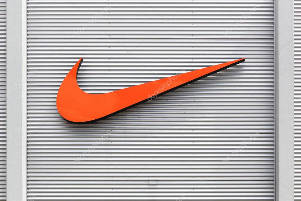 Bremen, Germany - July 2, 2017: Nike logo on a facade of a store. Nike is an American company specializing in sports equipment based in Beaverton, Oregon, USA