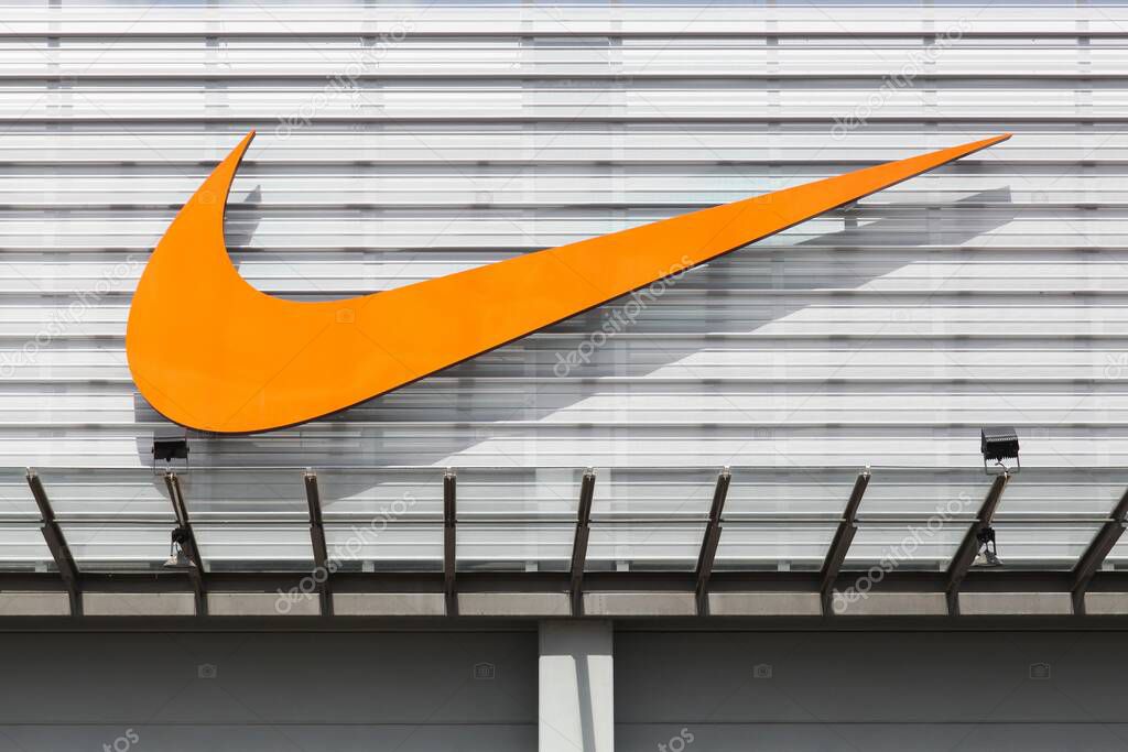 Bremen, Germany - July 2, 2017: Nike logo on a facade of a store. Nike is an American company specializing in sports equipment based in Beaverton, Oregon, USA