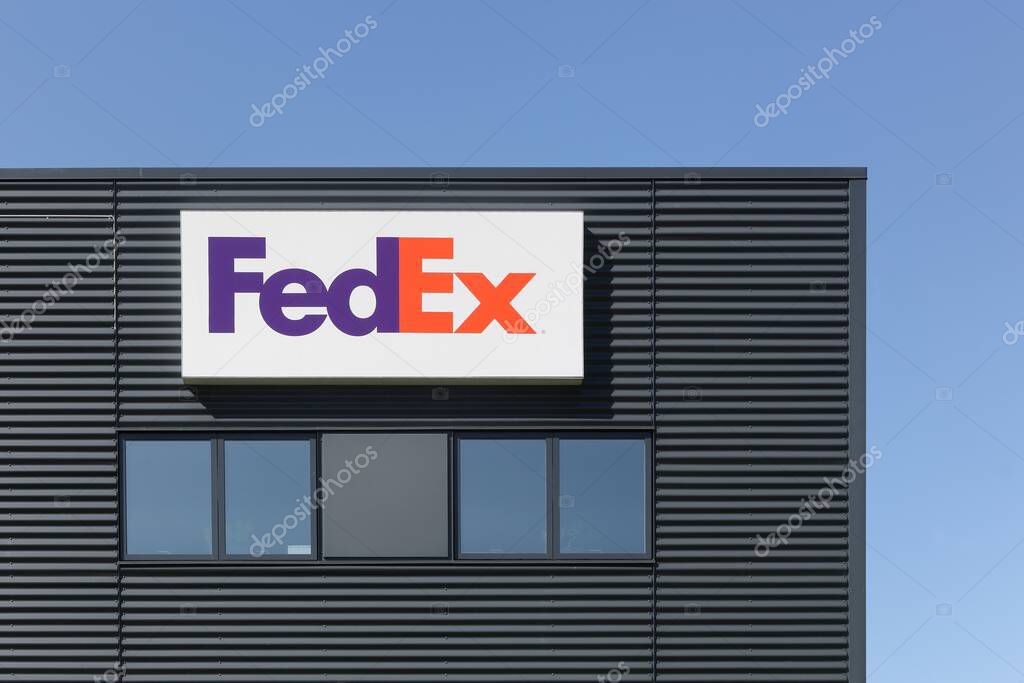 Odense, Denmark - April 9, 2017: FedEx building and warehouse. FedEx Corporation is an American global courier delivery services company headquartered in Memphis, Tennessee