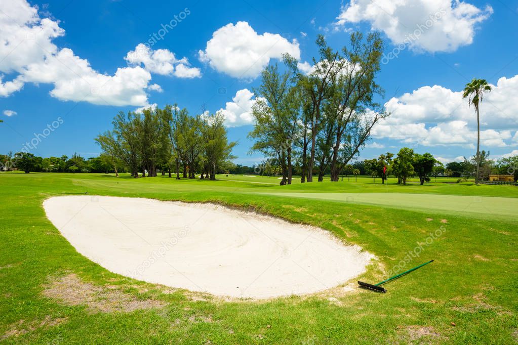 South Florida golf course landscape viewed from behind the sand trap.