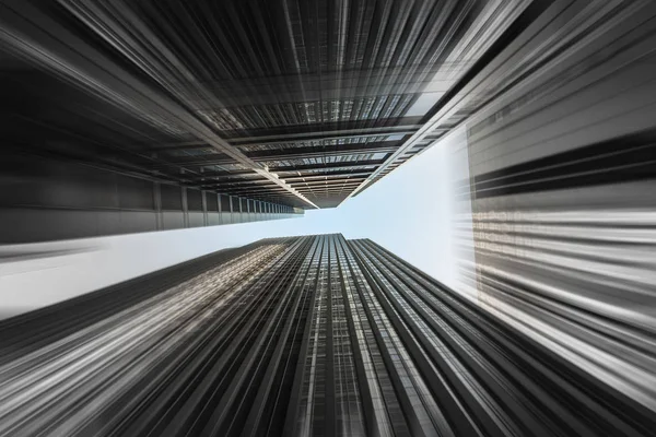 Skyward abstract view of modern skyscrapers in downtown Chicago with motion blur.