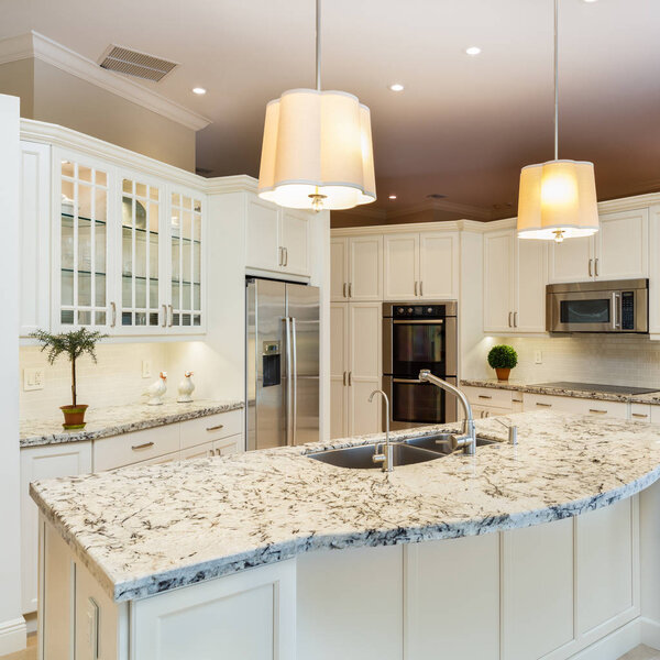 Beautiful home kitchen with white cabinets.