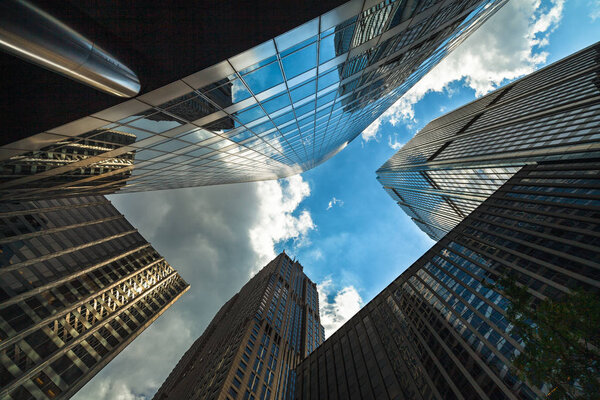 Upward view of modern skyscrapers in downtown Chicago.