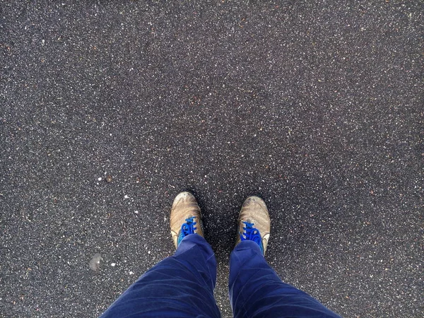 feet in shoes on asphalt, shoes, feet, asphalt, walking, road, shoe, street, foot, top, view, life, background, journey, urban, people, concept, standing, man, step, lifestyle, young, business, pavement, person, green