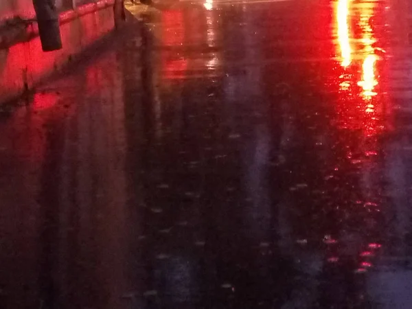wet asphalt, rain, in the city, reflection of traffic lights