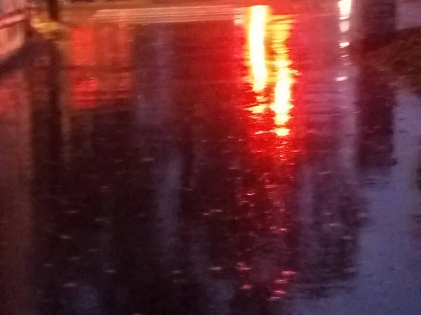 wet asphalt, rain, in the city, reflection of traffic lights