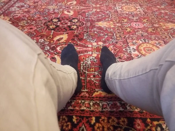 feet on the old carpet