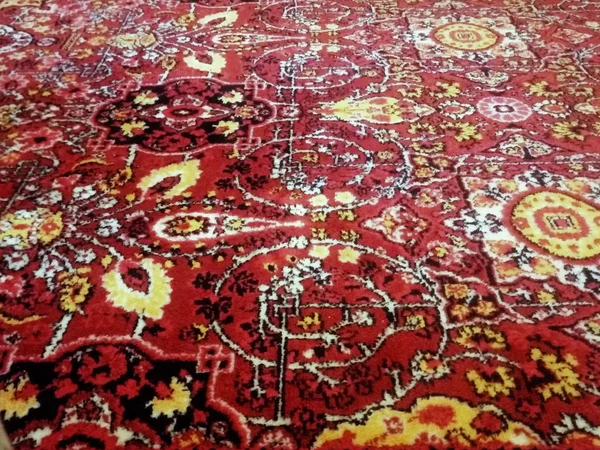 old red carpet on the floor in the house