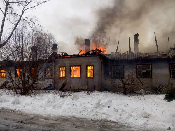 fire in an apartment building in winter in Russia