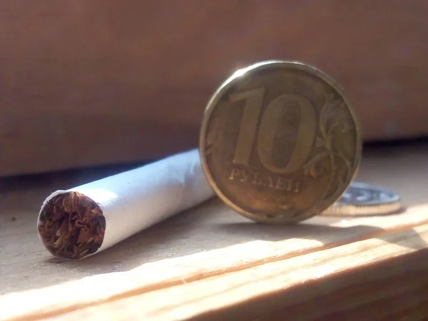 white cigarette and money coin, health, smoking, business