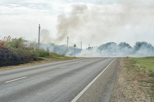 the fire on the side of the road