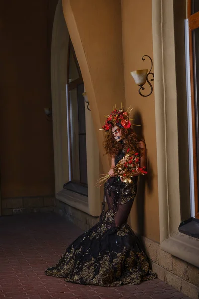 Portrait of a young beauty woman with sugar skull makeup