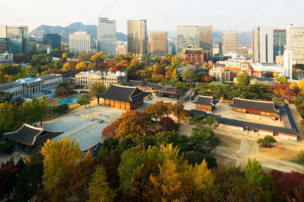 Deoksugung Palace and Seoul city in autumn season in Seoul, South Korea. 