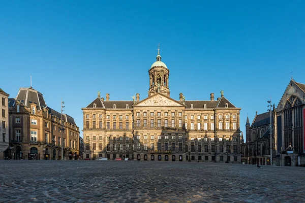Royal Palace at the Dam Square in Amsterdam, Netherlands. No people in Dam Square in Amsterdam, Netherlands.