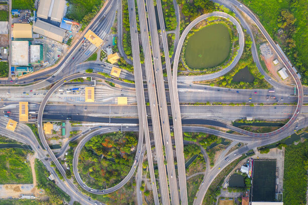Aerial View Above of Busy Highway Road Junctions at day. The Int
