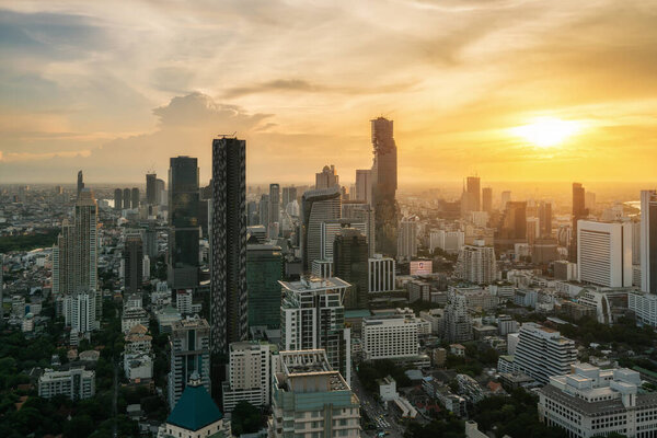 Bangkok, Thailand in Downtown area skyline view during sunset time from rooftop in Bangkok. Asian tourism, modern city life, or business finance and economy concep
