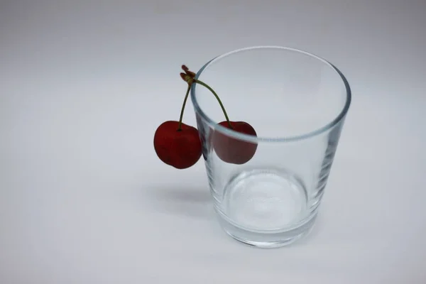 red cherries in a glass bowl
