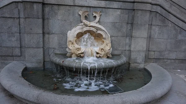 Madrid, spain, september, 8, 2020: original water fountain in calle Princesa in Madrid
