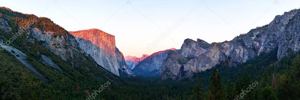 Yosemite valley nation park during sunset view from tunnel view on twilight time. Yosemite nation park, California, USA. Panoramic image.