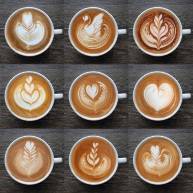 Latte sanat kahve kupalar ahşap arka plan üzerinde yukarıdan topluluğu.
