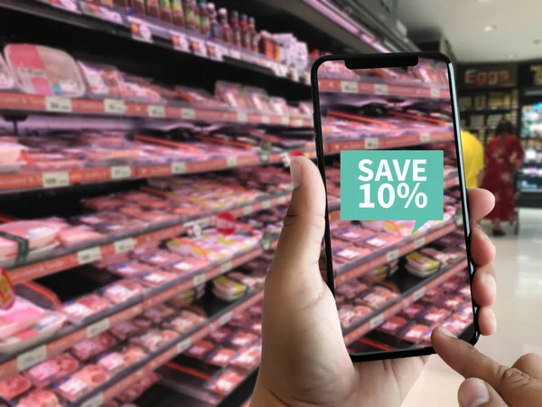 Family in the supermarket use Application of Augmented Reality Supermarket for Discounted or on Sale