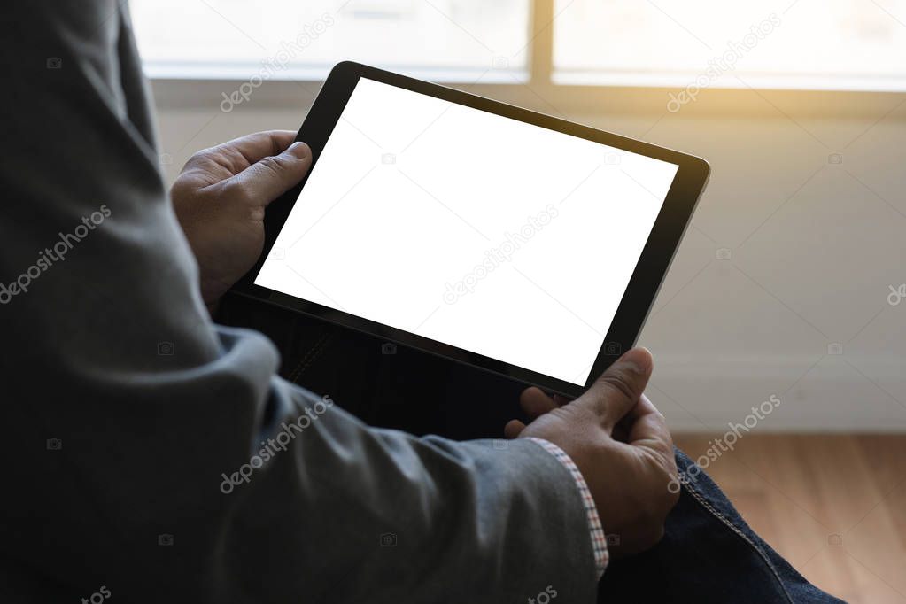 Digital tablet computer close up man using tablet hands man multitasking with isolated screen