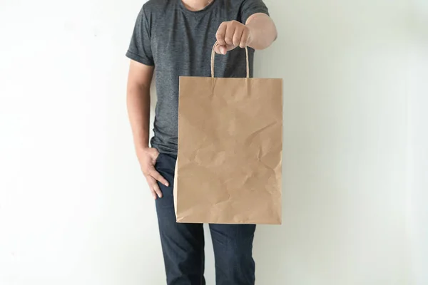 Consumer Pack Product Man Shows Bag Mock Show — Stock Photo, Image