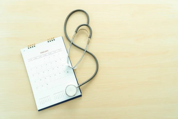 Medical appointment book in the calendar  stethoscope and calendar schedule to check up