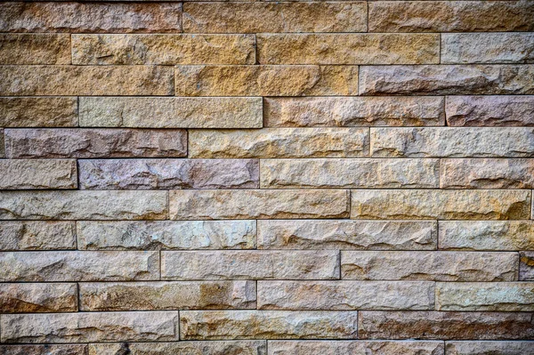 Stary tło wzór ściana brązowy kamiennych cegieł mur z cegły — Zdjęcie stockowe