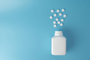 Mavi arka planda ilaç hapları. Çeşitli ilaçlar için metin kopyalama alanı. Sağlıklı beslenme, yaşam tarzı.