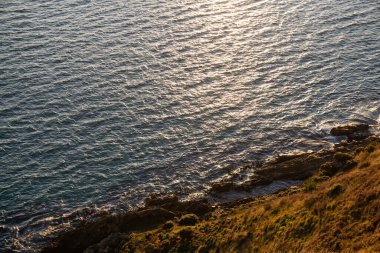 Nugget Point 'in bir kısmı Yeni Zelanda' nın Otago kıyıları boyunca deniz feneri ve kayalık adaların dağılımıyla en güzel manzaralardan biridir..
