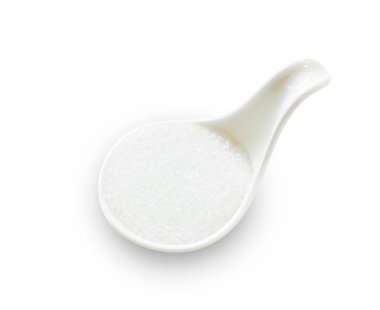 Beyaz kaşık içinde beyaz kamış şekeri.