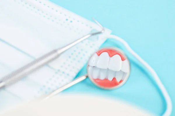 Focus white healthy teeth in mirror of dental equipment. Dental concept.