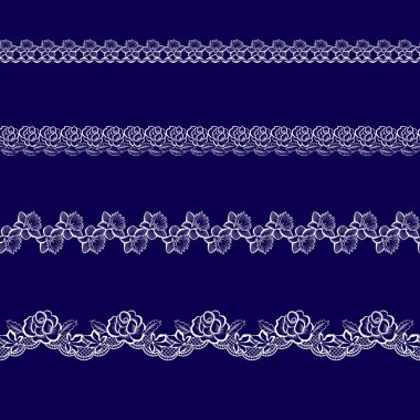 Beyaz dantel kurdeleler kümesi