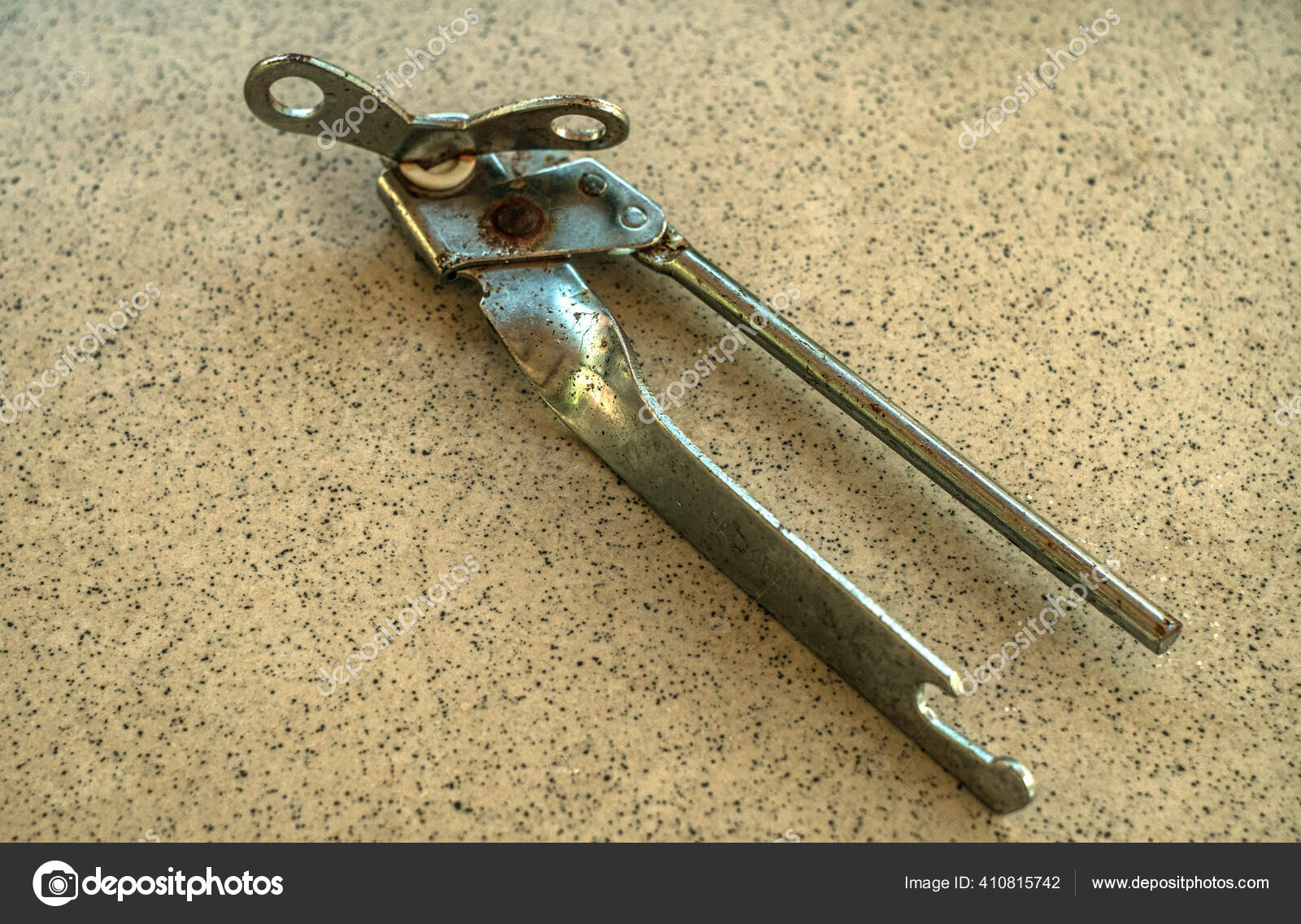 Old Rusty Can Opener Tile Table Stock Photo by ©andreyrut 410815742