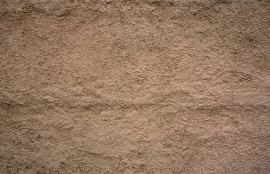 Sokaktaki sarı beton duvarın dokusu