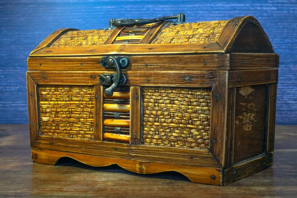 Old wooden chest with metal lock
