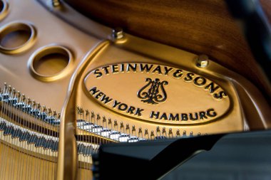 Appleton, WI - 20 May 2018 - A inside a grand piano featuring the logo of the Steinway & sons. clipart