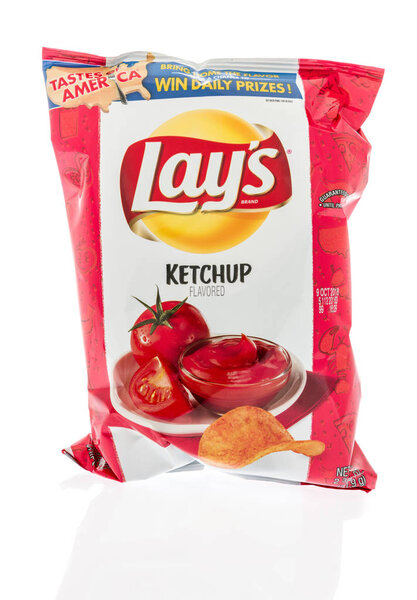 Winneconne, WI - 2 August 2018: A bag of Lay's  chips in ketchup flavor on an isolated background