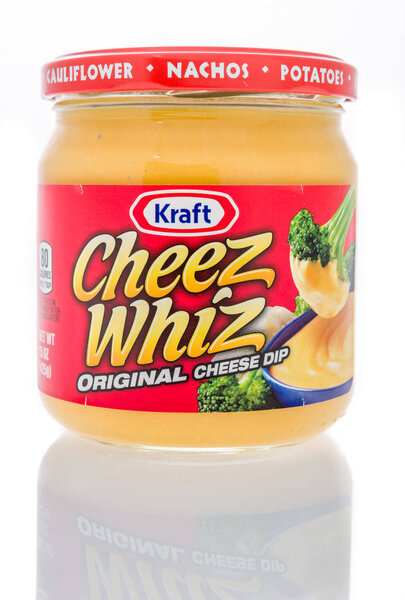 Winneconne, WI - 19 November 2018: A jar of Kraft Cheez Whiz original cheese dip on an isolated background.