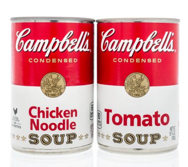 Winneconne, WI - 2 Feb 2019: A pair of can of Campbells soup in tomato and chicken noodle on an isolated background clipart