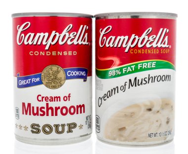 Winneconne, WI - 2 Feb 2019: A pair of can of Campbells soup in cream of mushroom of original and fat free on an isolated background clipart